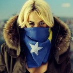 Now that's patriotism. Ora scarfed in Kosovo flag.
