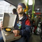 DJ Borka, listening to a retro iPod on a bus