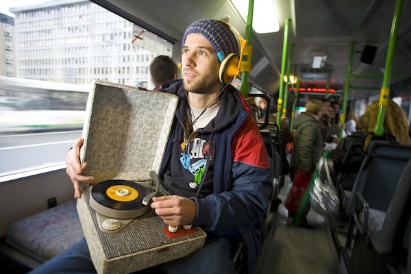 DJ Borka, listening to a retro iPod on a bus